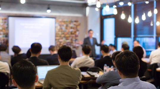 Group of students attending real estate training class